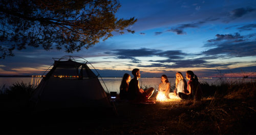 People gathering around a campfire.
