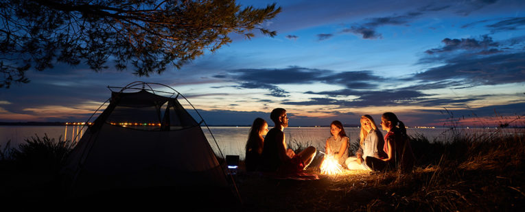 People gathering around a campfire.