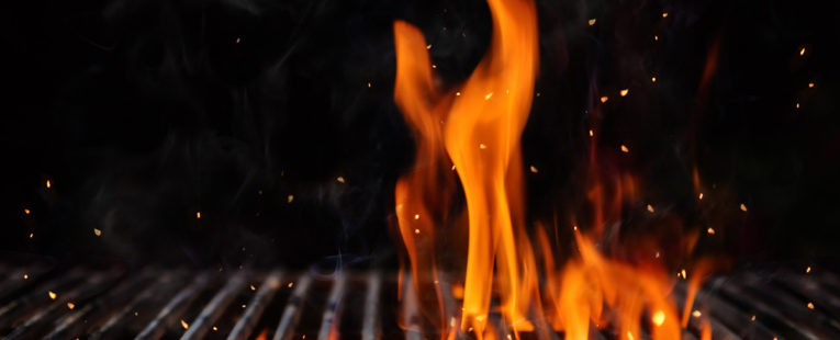 Flames on a bbq grill.
