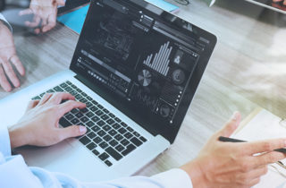 a lapttop shows data around the financial impact of COVID-19