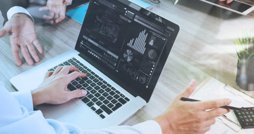 a lapttop shows data around the financial impact of COVID-19