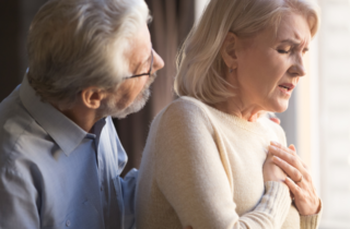 man helping woman with shortness of breath