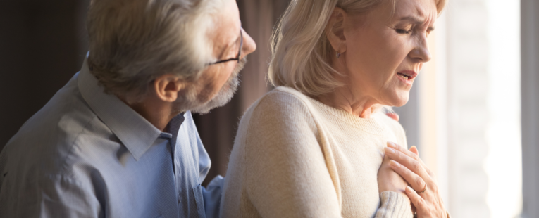 man helping woman with shortness of breath