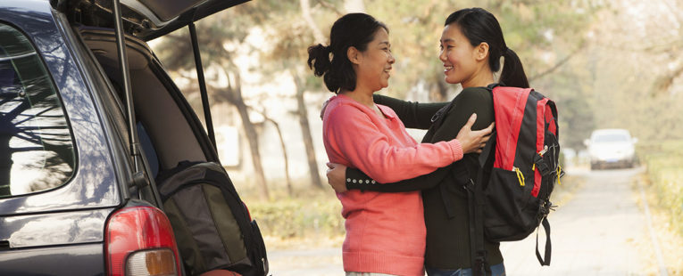 Asian-American mother dropping off daughter at college.