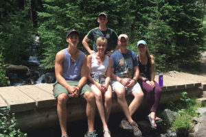 The Campbell family on vacation outdoors.