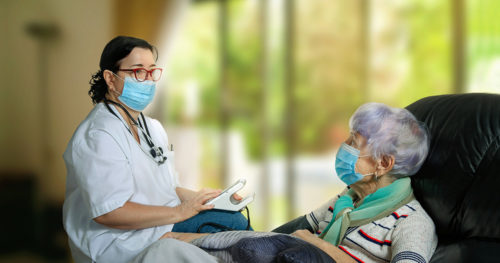Home health care worker with senior patient.