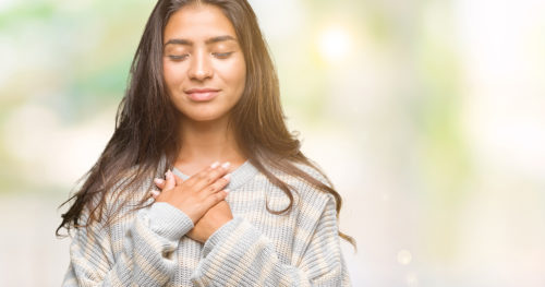 woman taking a self-compassion break