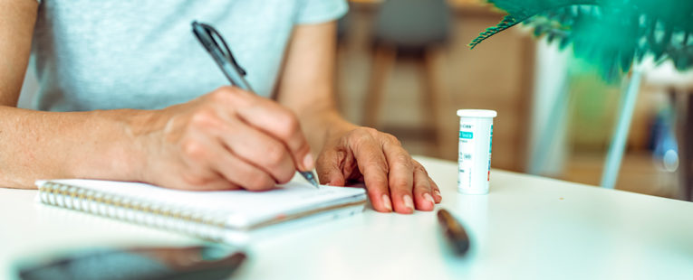 Senior woman with diabetes checking blood glucose levels.