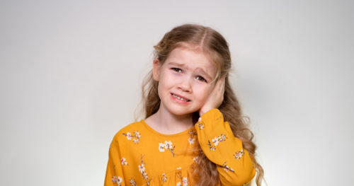Young girl with ear infection.