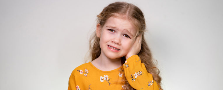 Young girl with ear infection.