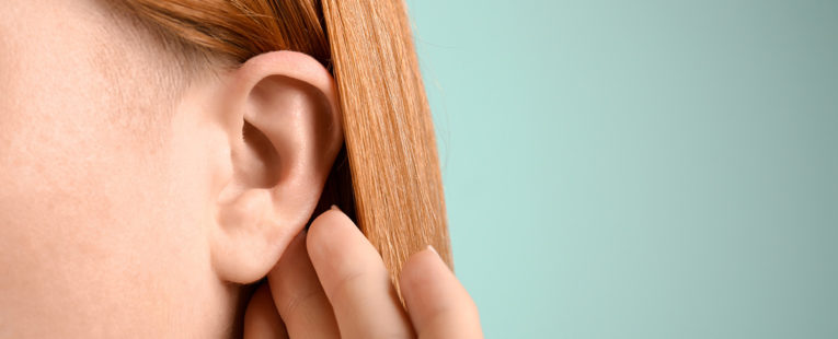 Young woman with ear infection.
