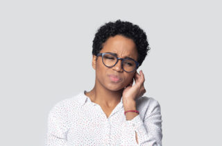 African-American woman with a painful ear infection