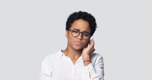 African-American woman with a painful ear infection