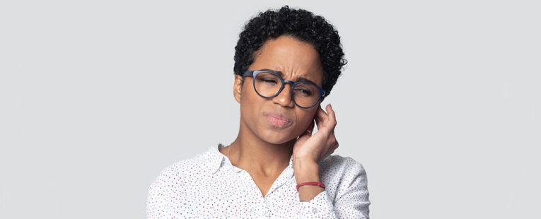 African-American woman with a painful ear infection