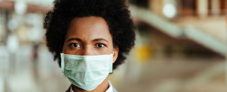 serious business woman wearing a mask