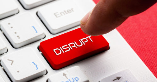 person presses a red disruption button on a keyboard