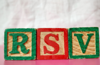 three childrens blocks spell out "RSV"
