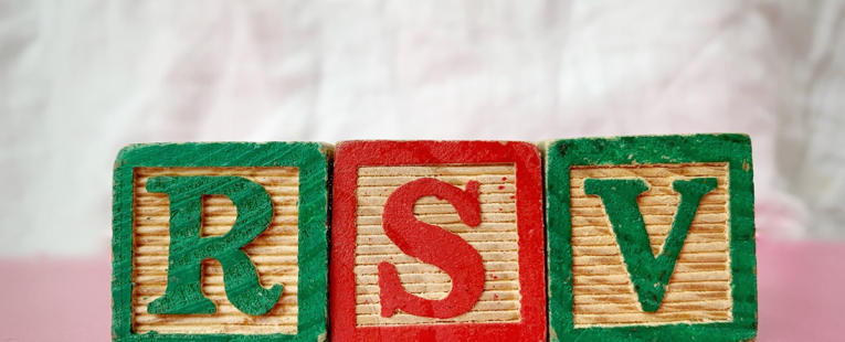 three childrens blocks spell out "RSV"