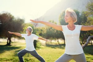 Two people doing stretches outside