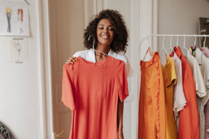 Cancer survivor trying on new clothes