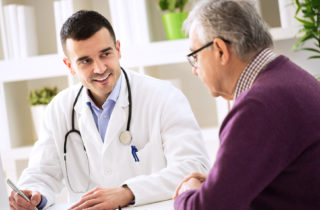 Man talking to doctor about care plan