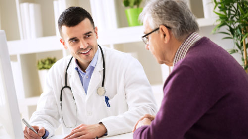 Man talking to doctor about care plan
