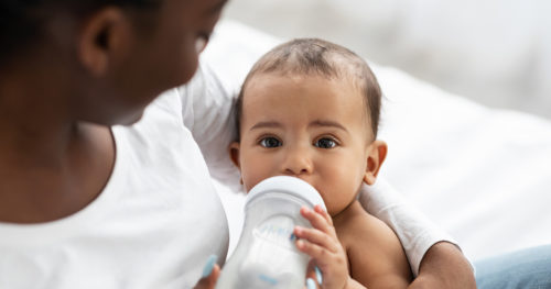 why do babies spit up