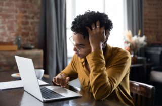 A person researches how to deal with cancer treatment stress.