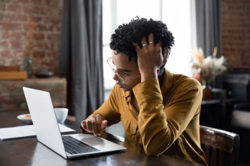 A person researches how to deal with cancer treatment stress.