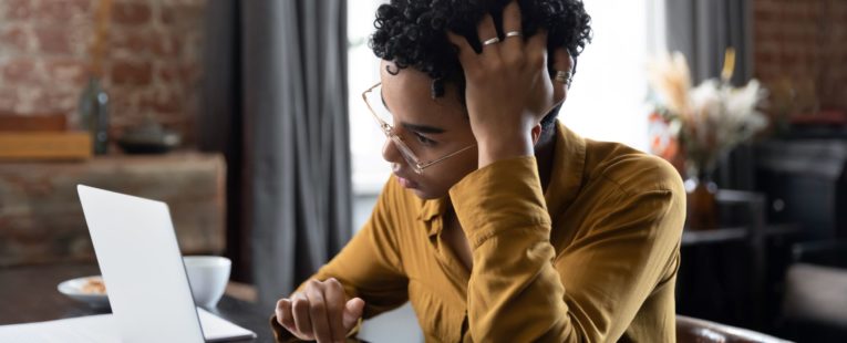 A person researches how to deal with cancer treatment stress.