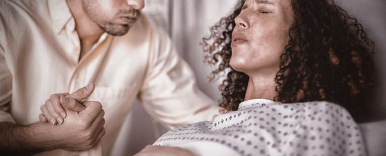 A mother in labor thinks about the different ways to manage pain.
