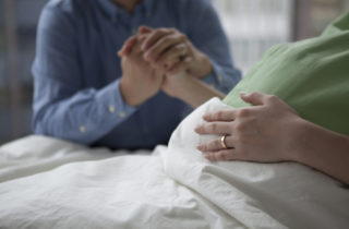 A pregnant woman prepares to have a natural birth.