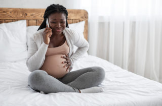 woman calling doctor about braxton hicks