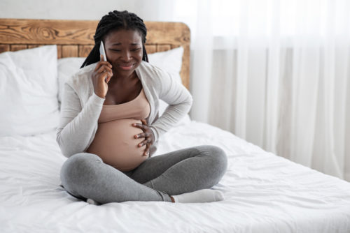woman calling doctor about braxton hicks