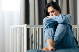Woman dealing with postpartum depression and/or baby blues.